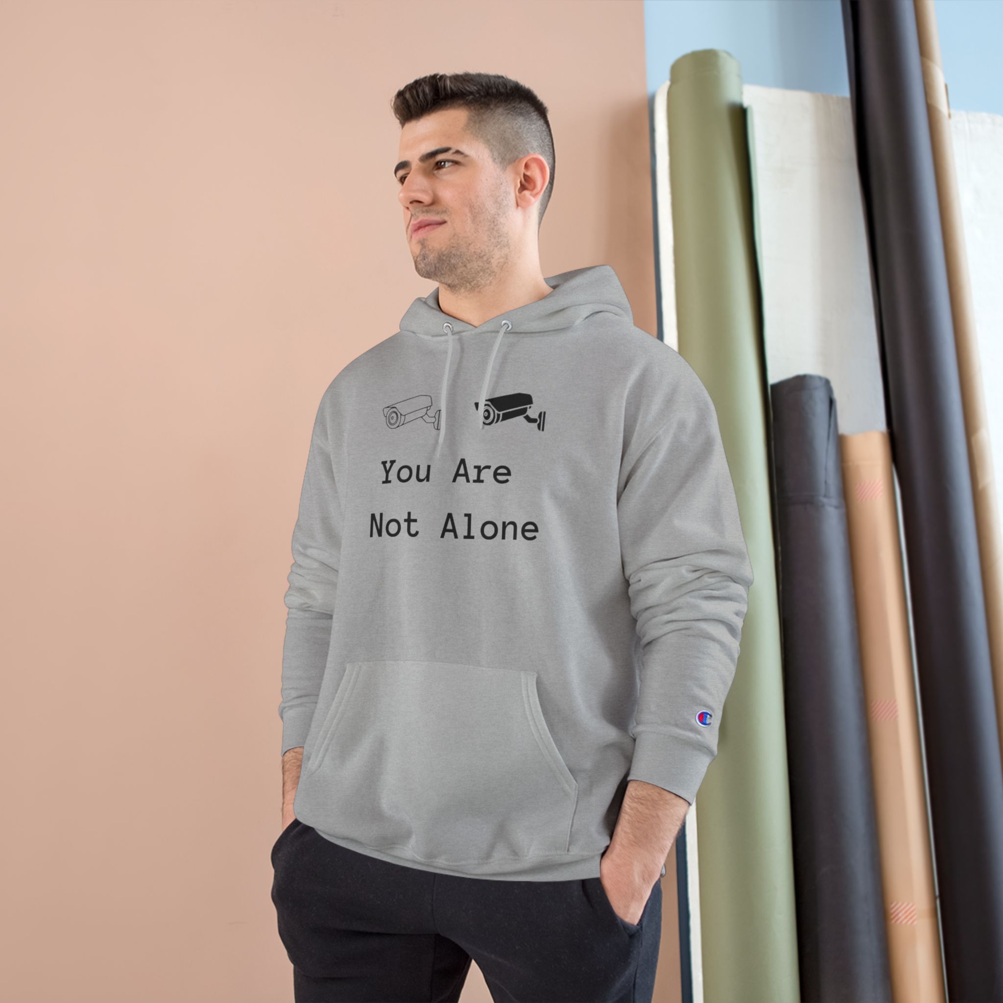 You Are Not Alone Hoodie – Minimalist Surveillance Camera Graphic Champion Hoodie - Image 3